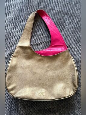 Anima Iris Metallic Gold Hobo with Hot Pink Lining